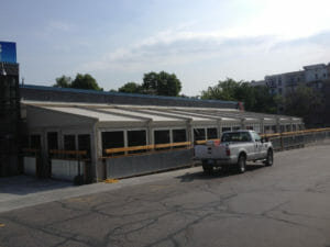 Motorized retractable canopy with motorized screen panels create a protected outdoor space