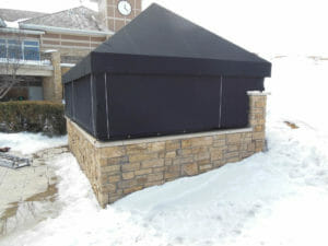 Roll porch curtains are an easy way to keep out the elements