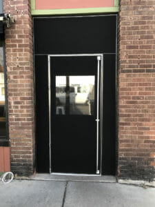 Seasonal vestibule panel by Acme Awning