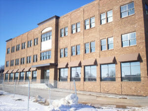 Traditional awnings with hard valances on commercial building