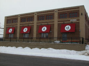 Acme Awning in Minneapolis builds custom awnings with graphics