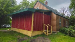 Canvas curtains installed on a screen porch by Acme Awning
