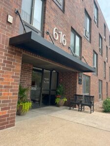 Commercial metal hanging rod canopy with weather-tight pans in Minneapolis by Acme Awning