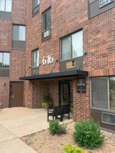 Commercial metal hanging rod canopy with weather-tight pans in Minnesota by Acme Awning