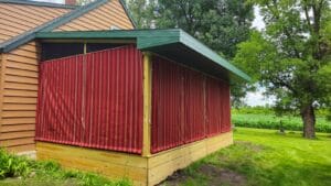 Porch curtains by Acme Awning on a screen porch in rural Minnesota