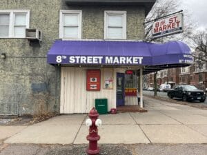 Before photo of a corner market in Minneapolis