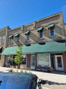 Storefront and window awnings by Acme Awning