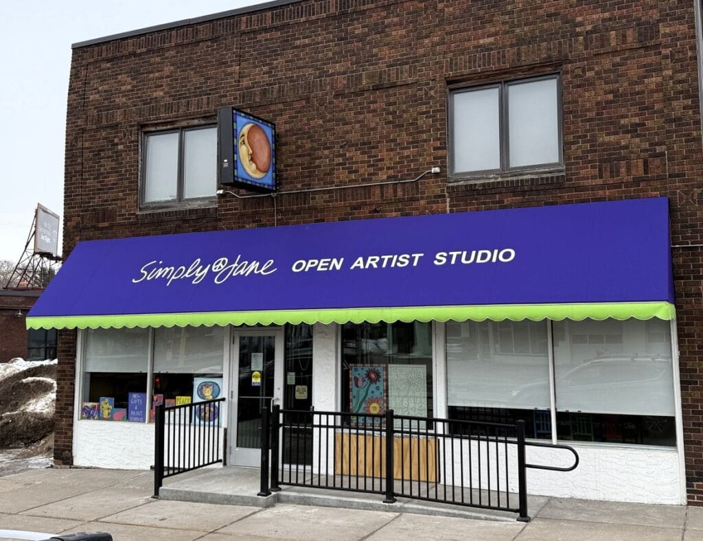 A close up of a new awning at Simply Jane on Cedar Ave S in MN