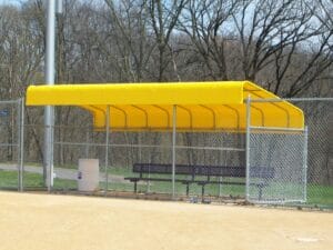 Yellow custom dugout cover by Acme Awning
